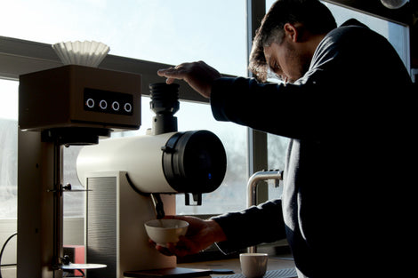 Image of Jamie grinding coffee