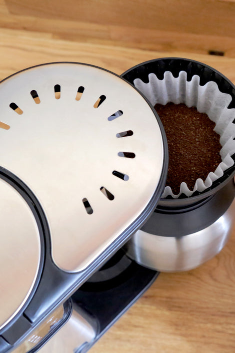 Photo of coffee grounds in a coffee machine. 