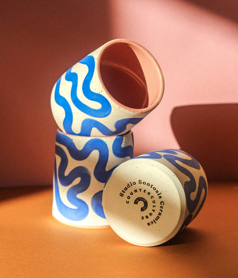 Photo of three Charleston mugs. Two are stacked and one is laying on its side.