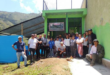 Photo of members of Agrocafe El Tambo in front of their coffee processing plant.