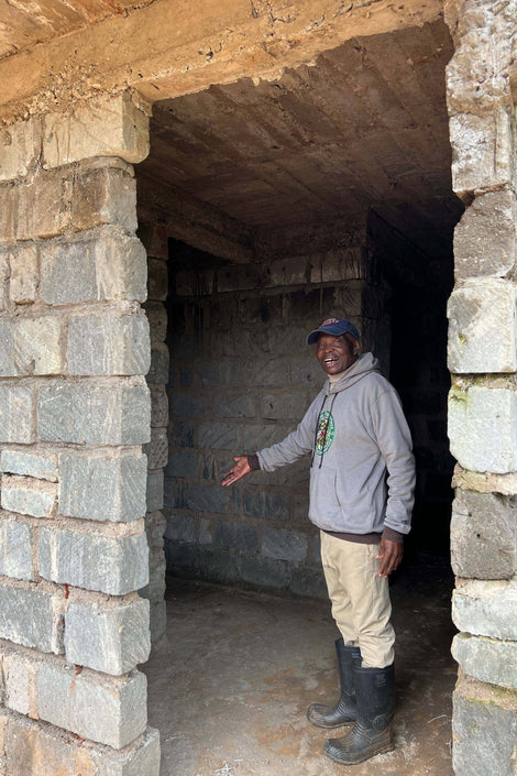 Nelson giving a tour of the unfinished guest house for seasonal workers' families.