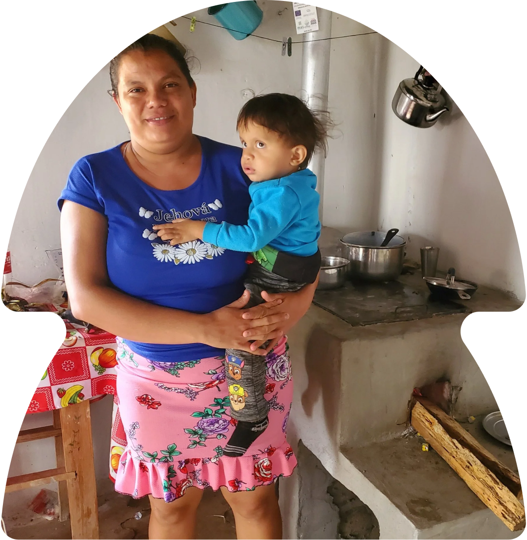 Community member with a clean cookstove